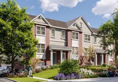 Front view of Insignia Glen 2 tri-level townhomes with modern design and landscaped greenery.